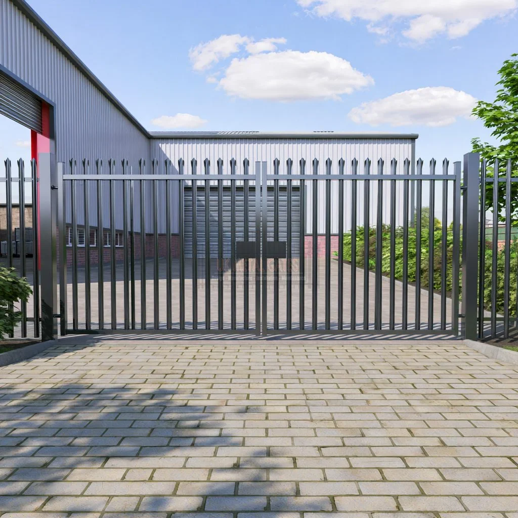 Home 79 Grey palisade gate across a paved industrial entrance.